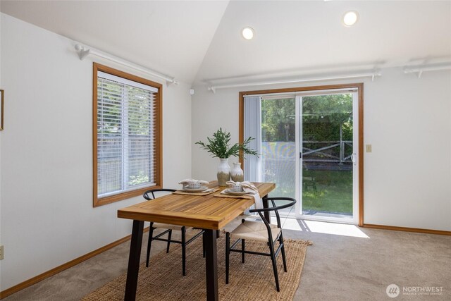 3901 Sterling Pl, Anacortes, WA 98221 - dining area with light colored carpet, plenty of natural light, baseboards, vaulted ceiling, and recessed lighting