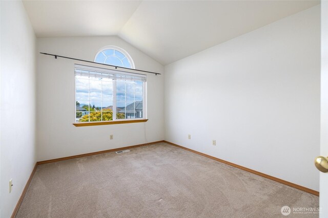 3901 Sterling Pl, Anacortes, WA 98221 - spare room featuring carpet floors, lofted ceiling, and baseboards