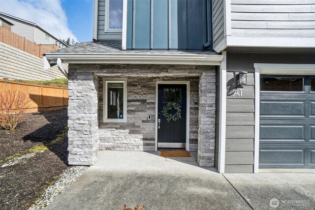 18901 12th Pl W Unit A1, Lynnwood, WA 98036 - doorway to property with a garage and stone siding