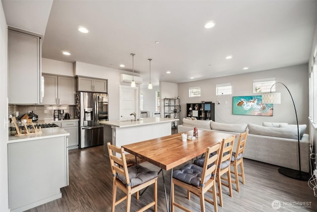 18901 12th Pl W Unit A1, Lynnwood, WA 98036 - dining area featuring recessed lighting, dark wood-style flooring, and a wall mounted air conditioner