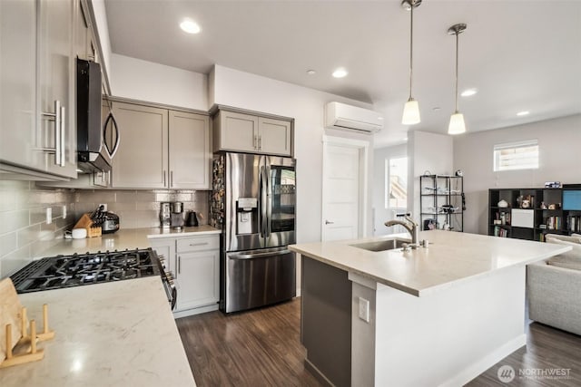 18901 12th Pl W Unit A1, Lynnwood, WA 98036 - kitchen featuring stainless steel appliances, a sink, a wall unit AC, dark wood-style flooring, and recessed lighting