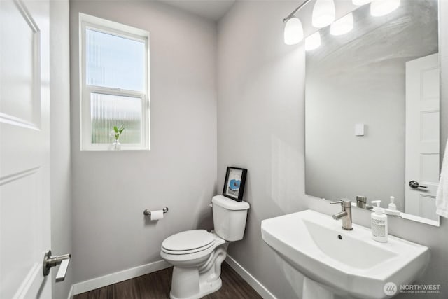 18901 12th Pl W Unit A1, Lynnwood, WA 98036 - half bath featuring a sink, toilet, wood finished floors, and baseboards