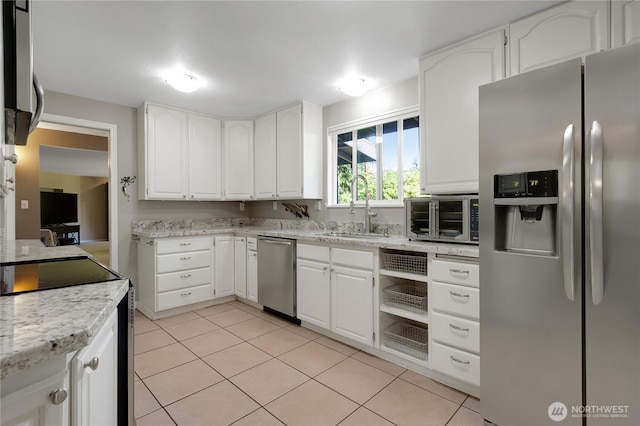 2419 SW 316th St, Federal Way, WA 98023 - kitchen with stainless steel appliances, a sink, white cabinetry, light tile patterned floors, and light stone counters