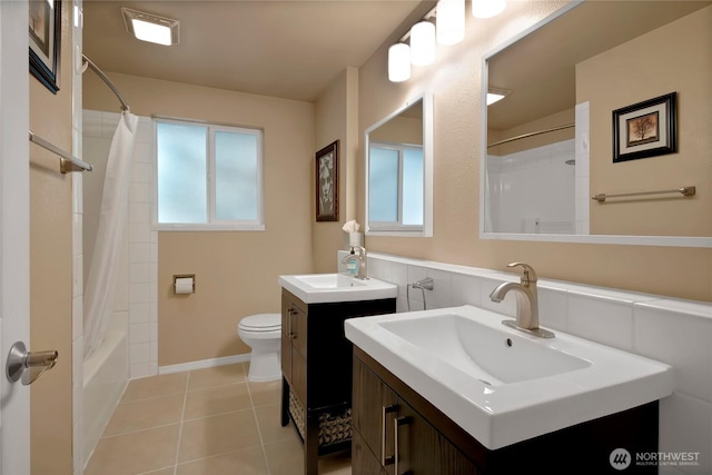 2419 SW 316th St, Federal Way, WA 98023 - full bath featuring toilet, healthy amount of natural light, two vanities, and shower / tub combo with curtain