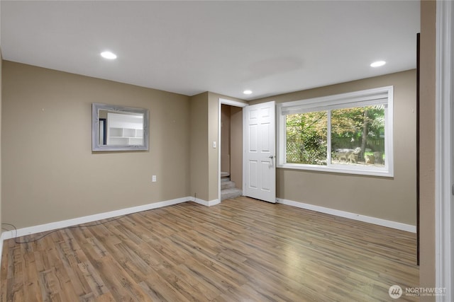 2419 SW 316th St, Federal Way, WA 98023 - unfurnished bedroom with light wood finished floors, baseboards, and recessed lighting