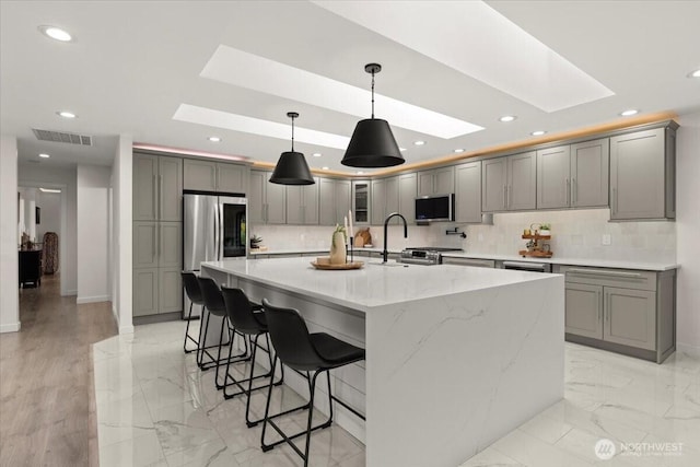 12125 E Woodland Ave, Puyallup, WA 98373 - kitchen featuring a skylight, smart refrigerator, a sink, gray cabinets, and recessed lighting