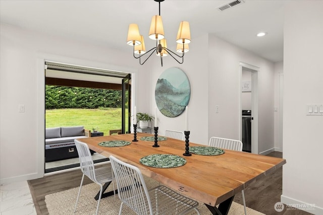 12125 E Woodland Ave, Puyallup, WA 98373 - dining space with baseboards, a chandelier, and recessed lighting