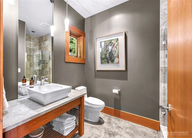 891 E Lake Samish Dr, Bellingham, WA 98229 - full bath featuring toilet, a tile shower, vanity, and baseboards
