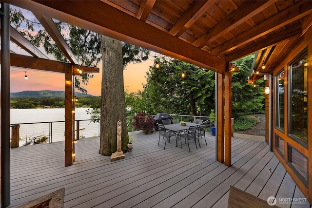 891 E Lake Samish Dr, Bellingham, WA 98229 - wooden terrace with outdoor dining space and a water view