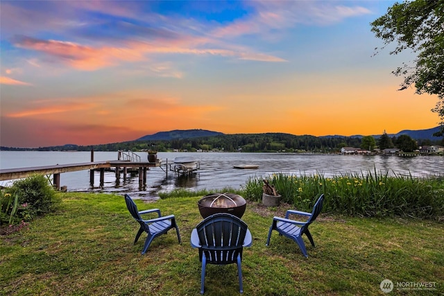 891 E Lake Samish Dr, Bellingham, WA 98229 - dock featuring a fire pit, a water and mountain view, and a lawn