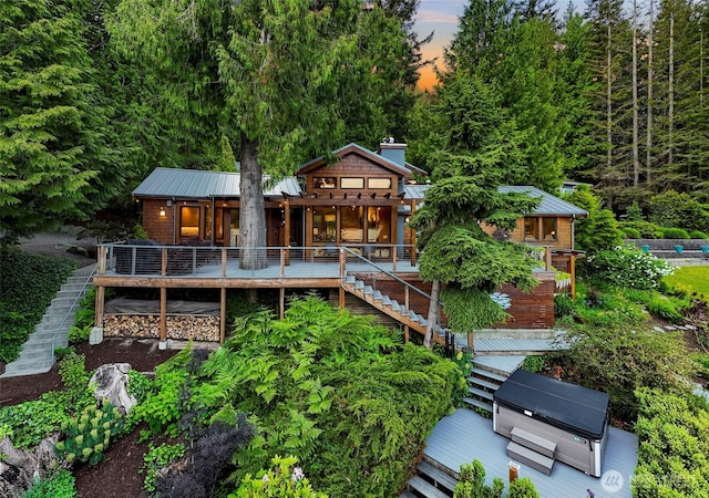891 E Lake Samish Dr, Bellingham, WA 98229 - rear view of property with stairs, a deck, and metal roof