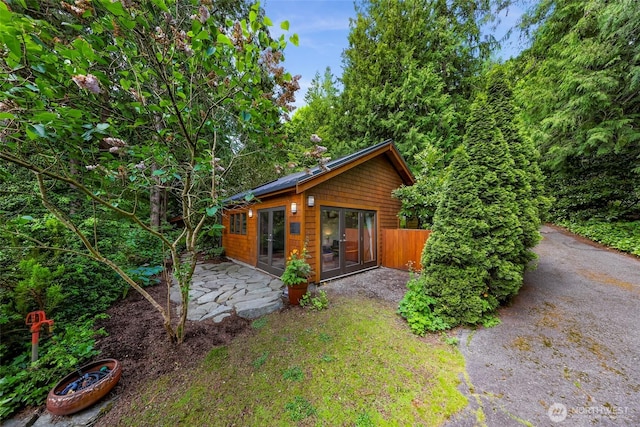 891 E Lake Samish Dr, Bellingham, WA 98229 - view of front of house featuring french doors and a patio