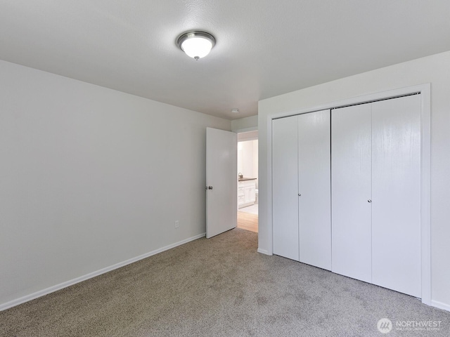 25705 117th Pl SE, Kent, WA 98030 - unfurnished bedroom with carpet flooring, a closet, and baseboards