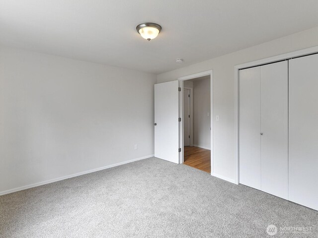 25705 117th Pl SE, Kent, WA 98030 - unfurnished bedroom with carpet floors, baseboards, and a closet