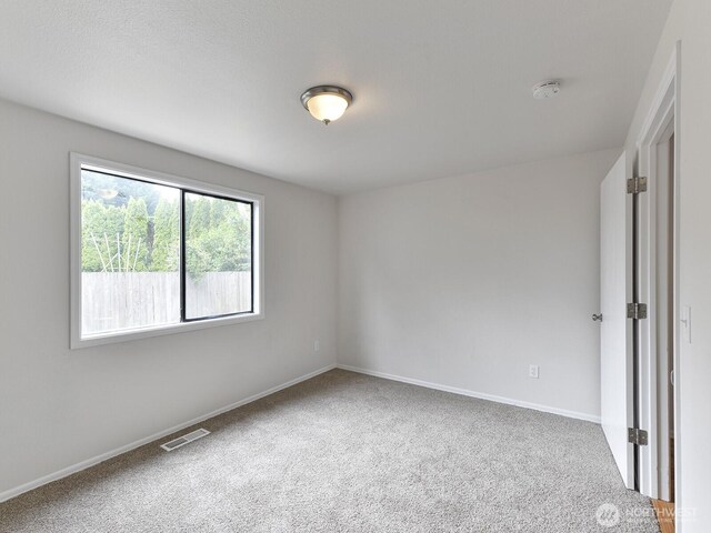 25705 117th Pl SE, Kent, WA 98030 - empty room featuring a smoke detector, carpet, and baseboards