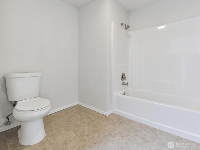 25705 117th Pl SE, Kent, WA 98030 - full bathroom with toilet, shower / washtub combination, and baseboards