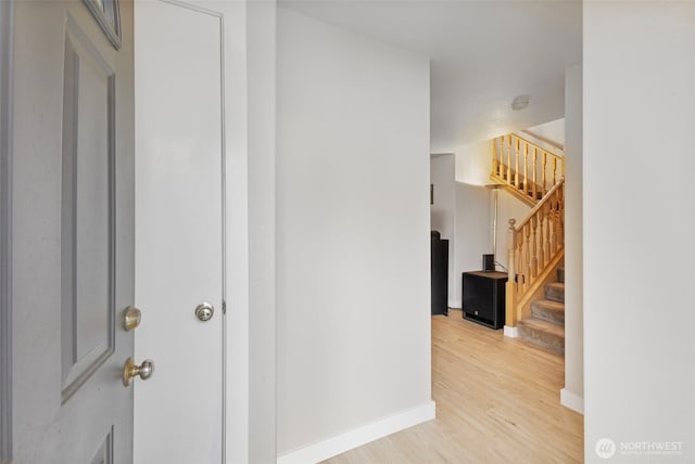 125 99th Street Ct E, Tacoma, WA 98445 - hallway with light wood-style flooring, stairs, and baseboards