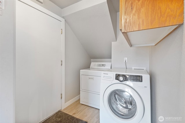 125 99th Street Ct E, Tacoma, WA 98445 - laundry area with washer and dryer, light wood finished floors, and baseboards