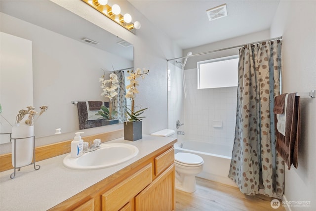 125 99th Street Ct E, Tacoma, WA 98445 - full bath featuring vanity, shower / tub combo, toilet, and wood finished floors
