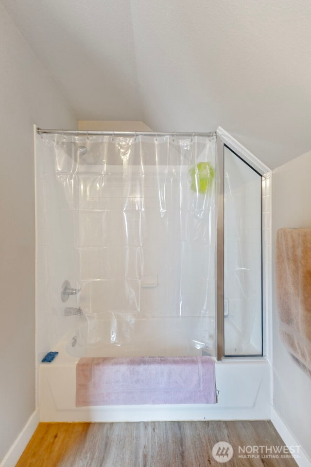 125 99th Street Ct E, Tacoma, WA 98445 - bathroom with wood finished floors, baseboards, and shower / bath combination