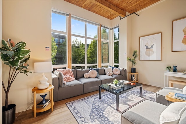 1812 19th Ave Unit 205, Seattle, WA 98122 - living area with wooden ceiling with exposed beams, light wood-style flooring, and baseboards
