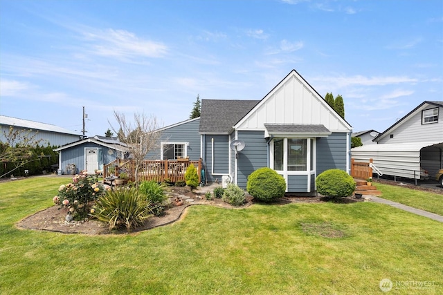 367 Colorado St, Longview, WA 98632 - view of front facade featuring board and batten siding, a deck, a front lawn, and roof with shingles