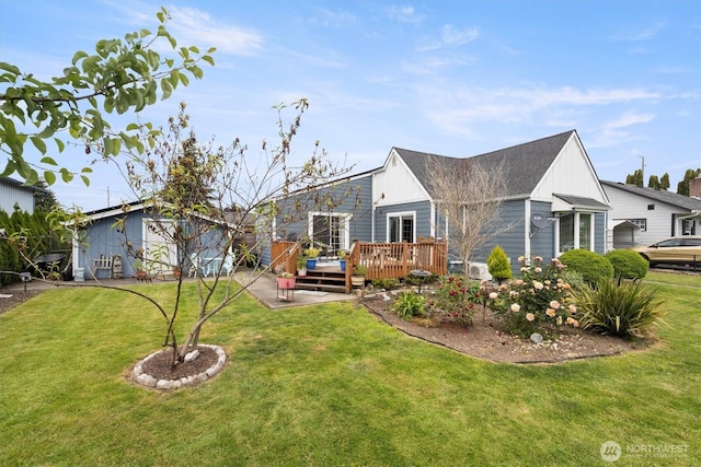 367 Colorado St, Longview, WA 98632 - rear view of house with a deck, a yard, and board and batten siding