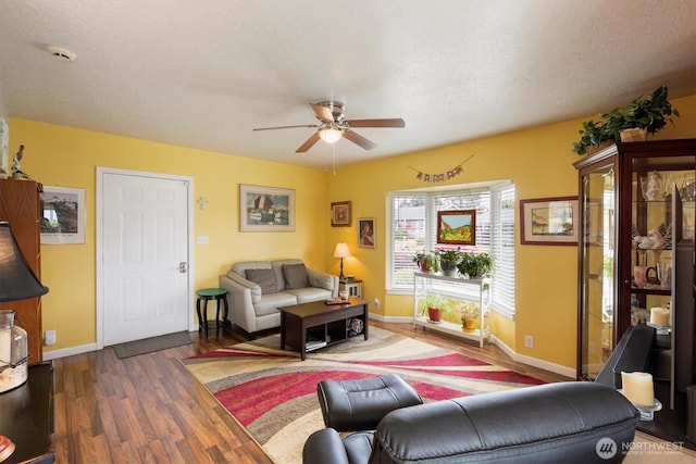 367 Colorado St, Longview, WA 98632 - living area featuring a ceiling fan, wood finished floors, and baseboards