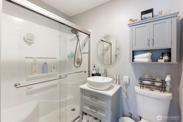 367 Colorado St, Longview, WA 98632 - bathroom with vanity, a stall shower, and toilet