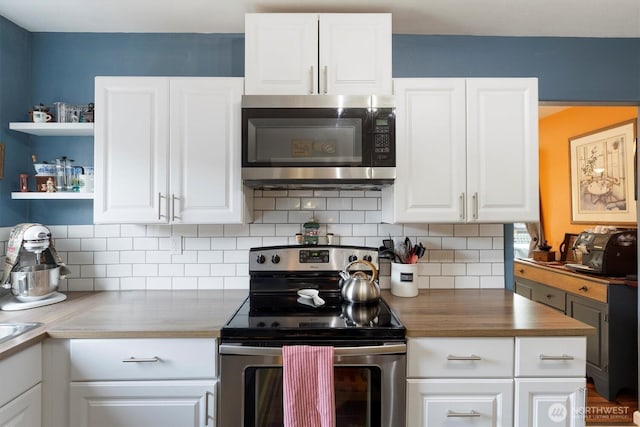 367 Colorado St, Longview, WA 98632 - kitchen featuring stainless steel appliances, tasteful backsplash, white cabinets, and open shelves