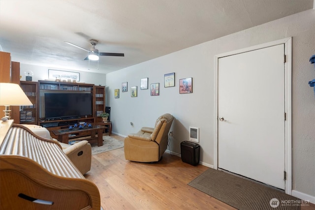 367 Colorado St, Longview, WA 98632 - living room with light wood-style flooring, ceiling fan, heating unit, and baseboards