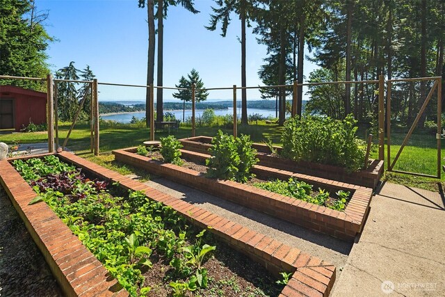 12010 SW Wesleyan Way Unit 1, Vashon, WA 98070 - view of community with a vegetable garden and a water view