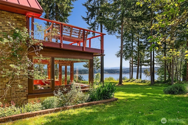 12010 SW Wesleyan Way Unit 1, Vashon, WA 98070 - view of grassy yard featuring a deck with water view