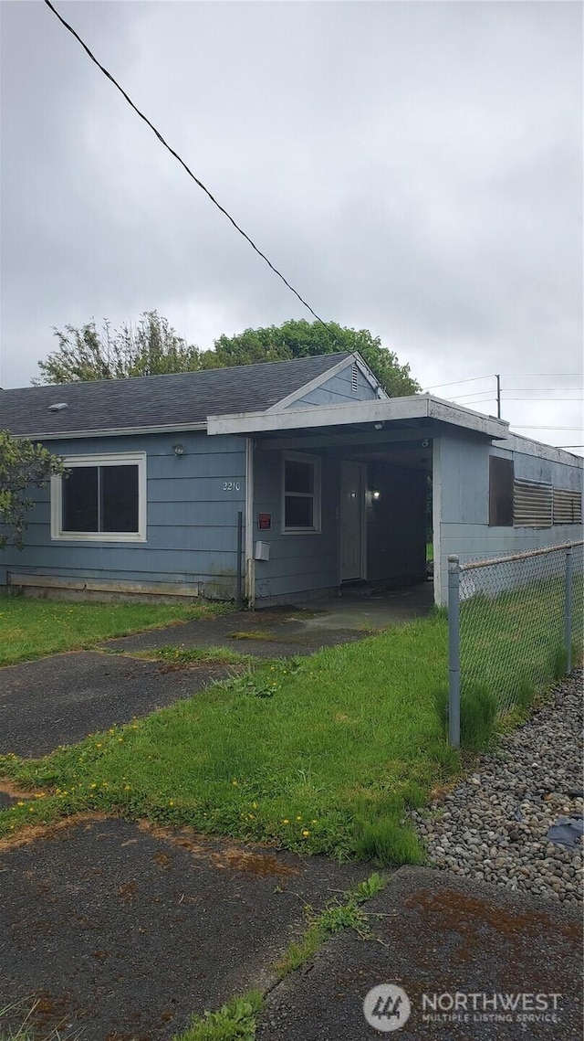 2210 Aberdeen Ave, Hoquiam, WA 98550 - view of front of property featuring roof with shingles and a carport