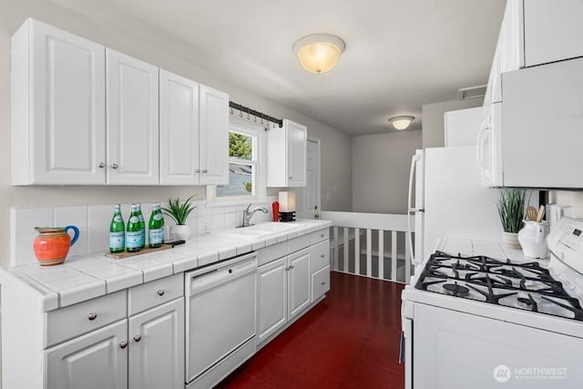 6050 36th Ave SW, Seattle, WA 98126 - kitchen featuring white appliances, a sink, white cabinets, backsplash, and light countertops