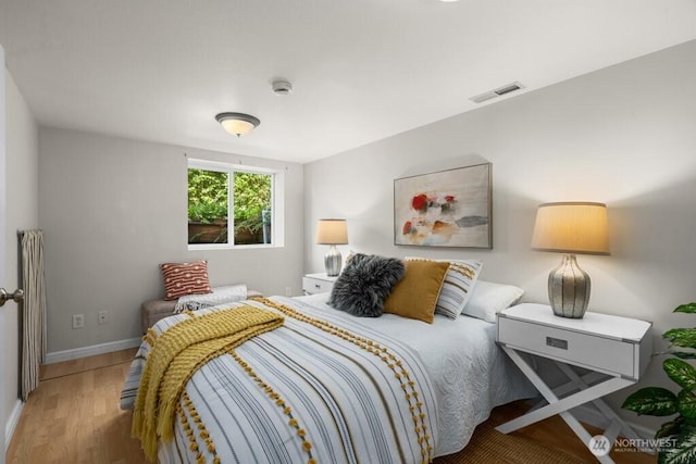 6050 36th Ave SW, Seattle, WA 98126 - bedroom featuring wood finished floors and baseboards