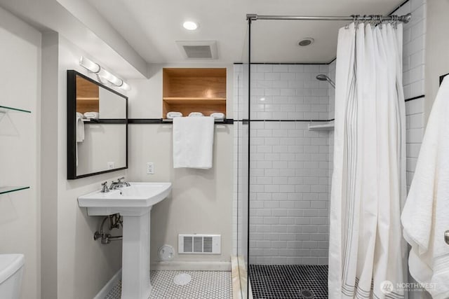 6050 36th Ave SW, Seattle, WA 98126 - full bathroom featuring a shower stall, toilet, tile patterned floors, recessed lighting, and baseboards