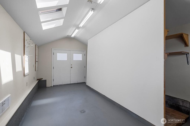6050 36th Ave SW, Seattle, WA 98126 - additional living space with a skylight, finished concrete flooring, and vaulted ceiling