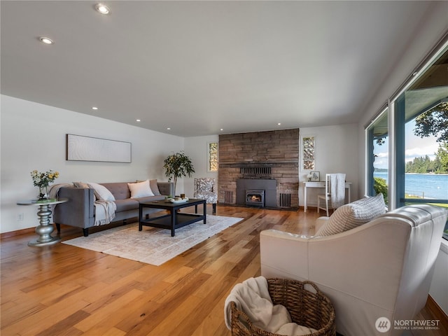 6341 NE Balzow Rd, Suquamish, WA 98392 - living area with light wood-style flooring, recessed lighting, and a fireplace
