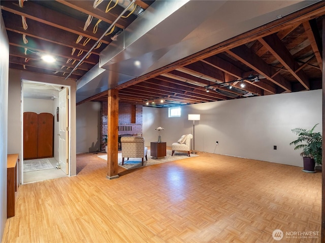 6341 NE Balzow Rd, Suquamish, WA 98392 - basement with parquet flooring and a fireplace