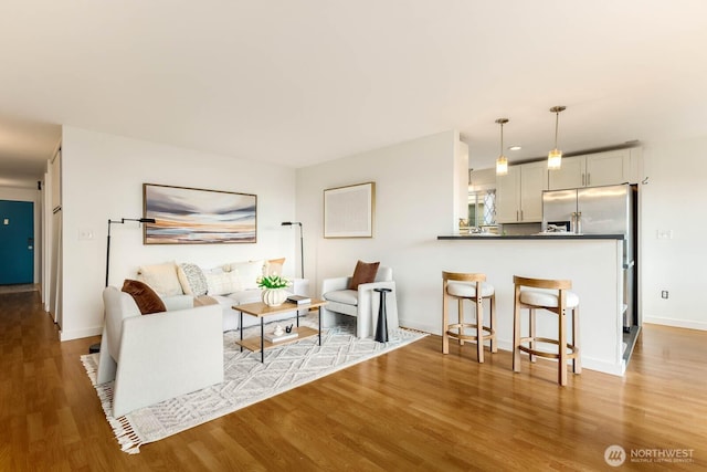 11515 Greenwood Ave N Unit C, Seattle, WA 98133 - living area featuring wood finished floors and baseboards