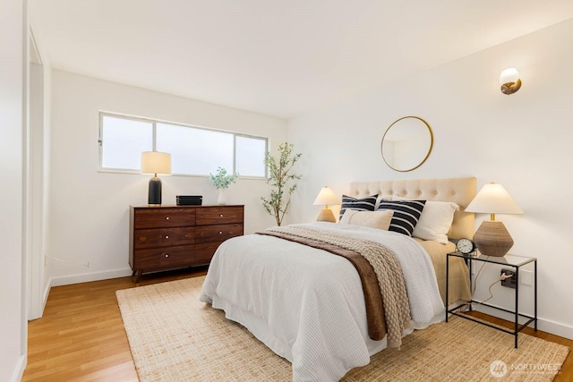 11515 Greenwood Ave N Unit C, Seattle, WA 98133 - bedroom with baseboards and light wood-type flooring