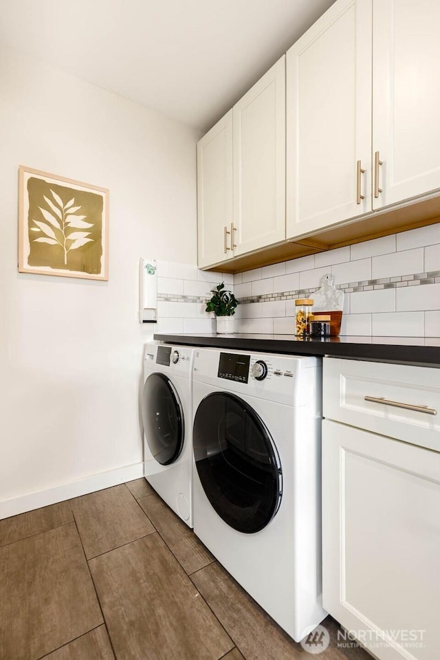 11515 Greenwood Ave N Unit C, Seattle, WA 98133 - laundry area with washing machine and clothes dryer, cabinet space, and baseboards