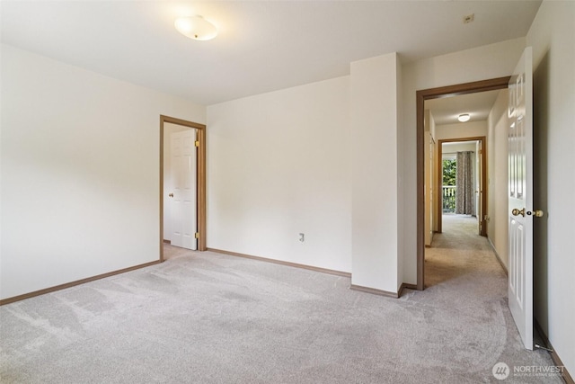 2419 S Meridian Unit B8, Puyallup, WA 98373 - empty room featuring light colored carpet and baseboards
