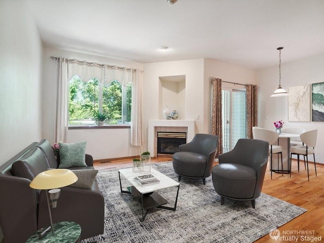 2419 S Meridian Unit B8, Puyallup, WA 98373 - living room featuring a fireplace and wood finished floors