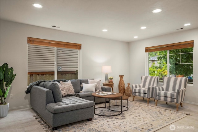 living room with recessed lighting, carpet flooring, and baseboards