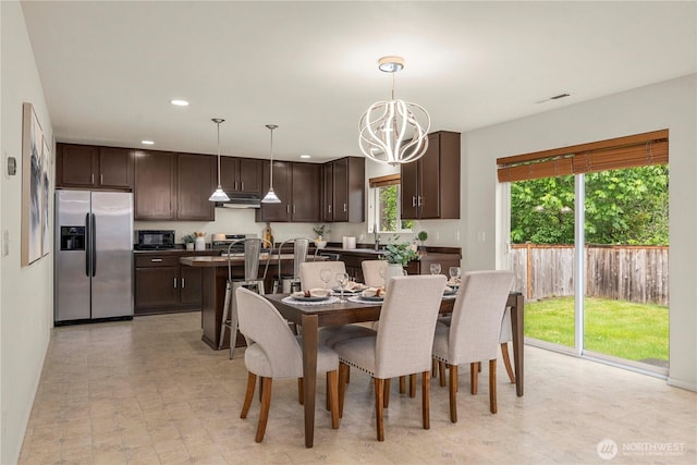 dining room featuring recessed lighting and a chandelier