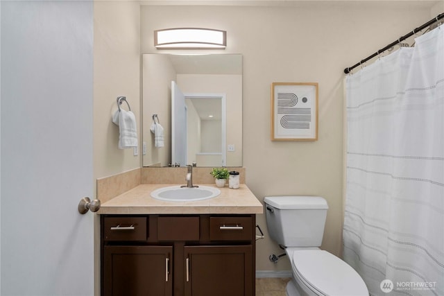 bathroom featuring toilet and vanity