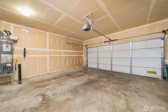 garage with water heater and a garage door opener
