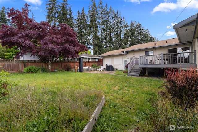 view of yard featuring a deck and a garden